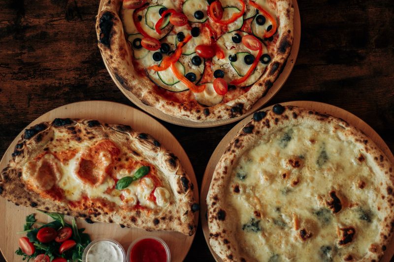 giordanos pizza slices on a wooden board in Chicago